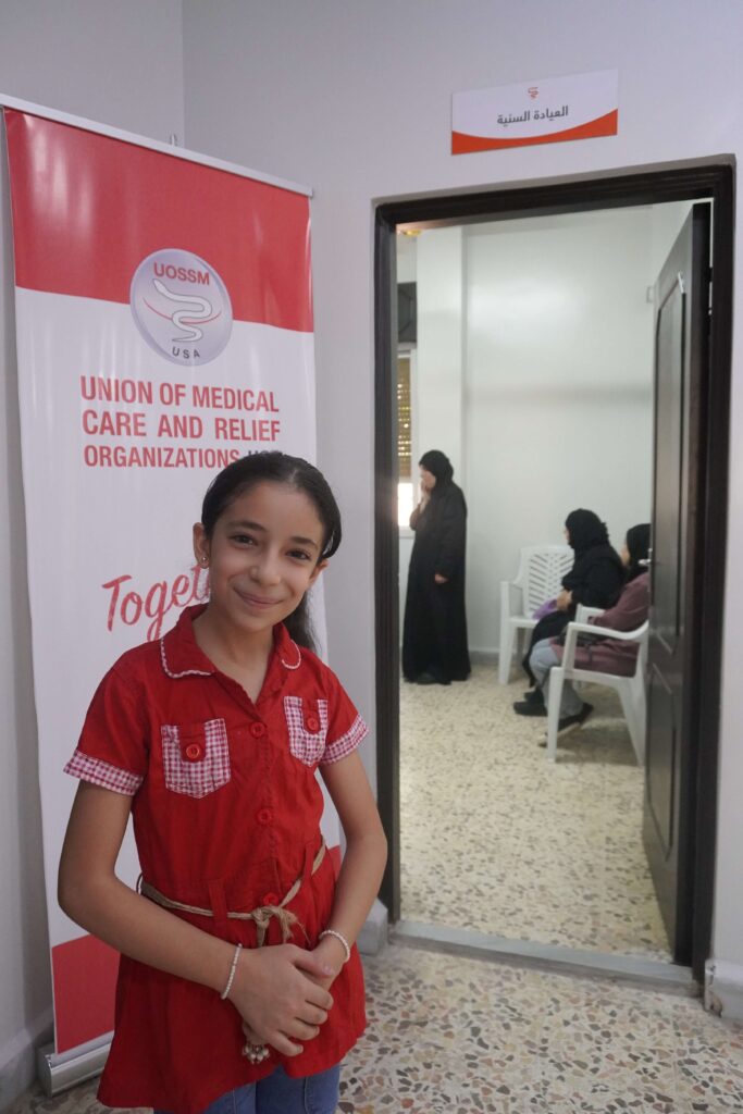 Sanaa smiling after her dental visit at Gharb Al Mashtal PHC in Hama