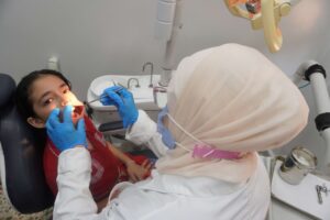 Sanaa being examined by her dentist.