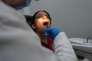 Sanaa getting her tooth removed.